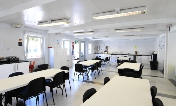 Kitchen with table and chairs in an construction accommodation cabin