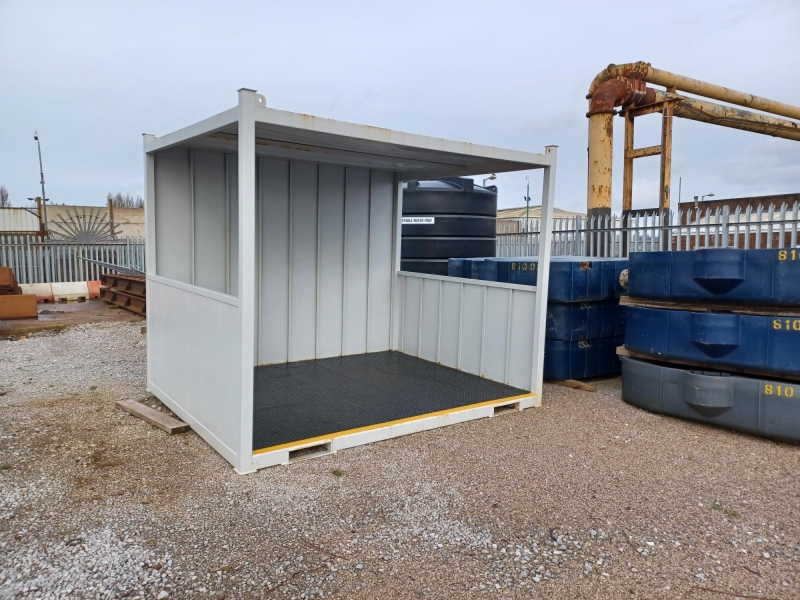 Steel smoking shelter in workshop yard