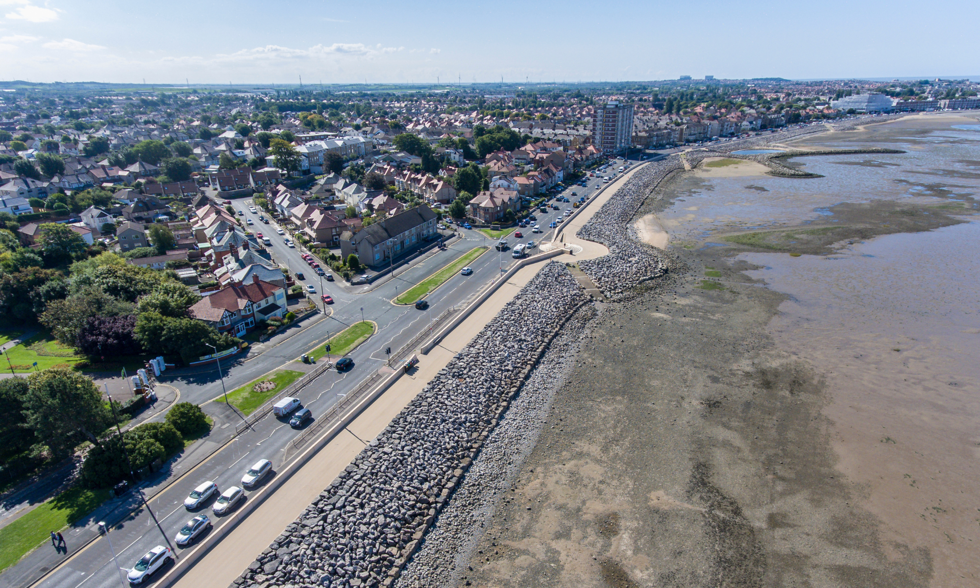 Aerial shot looking down on the wave wall along Morecambe coastline