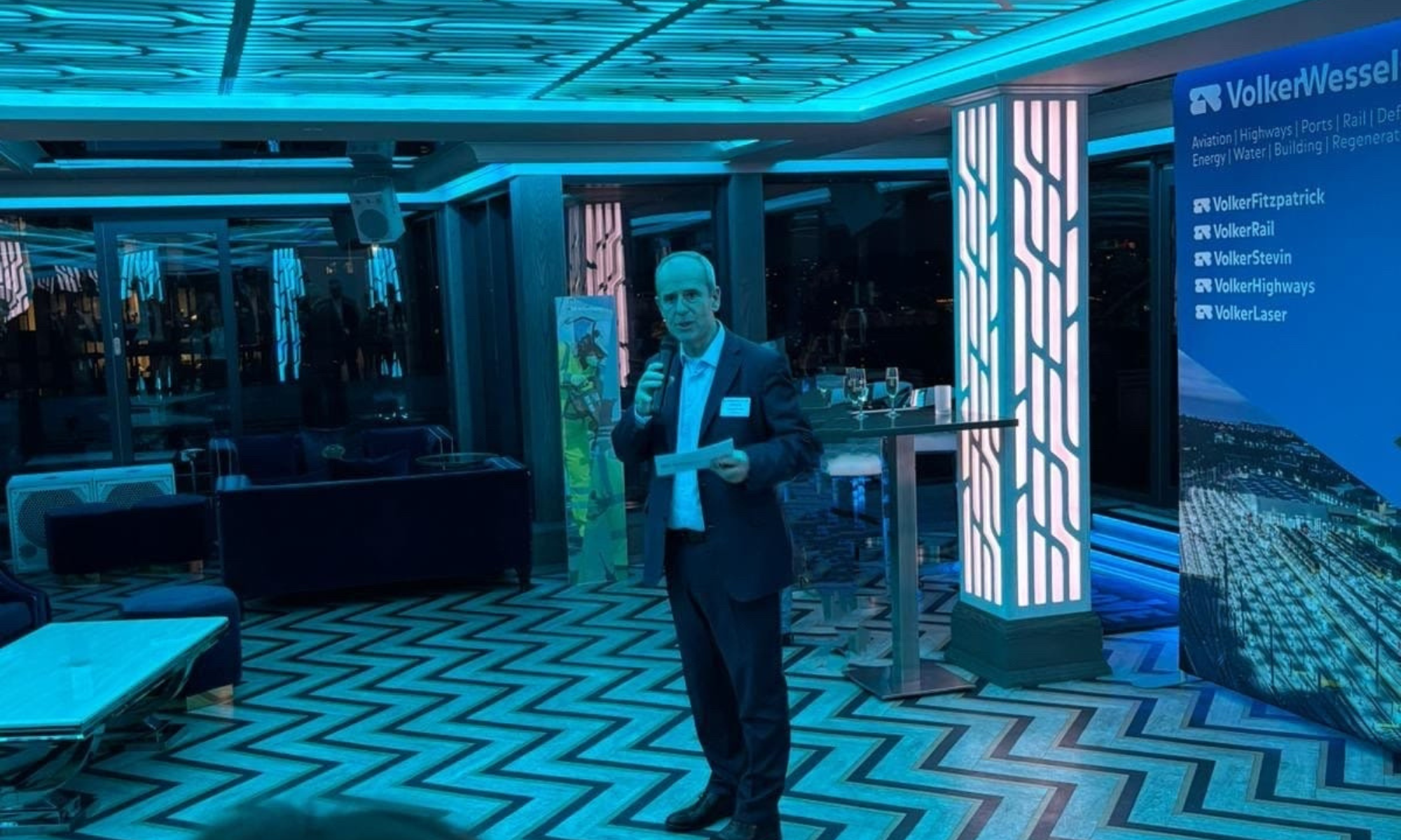 Man stood in suite presenting